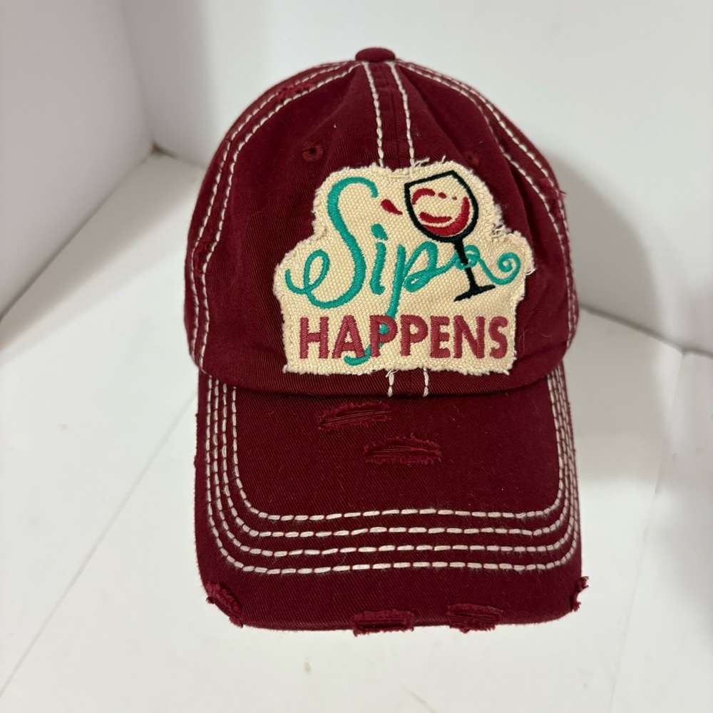 Embroidered Cap "Sip Happens" in teal and brown, a with a smiling wine glass. - Picture 2 of 6
